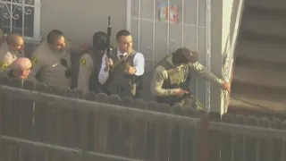 Suspect in custody after Compton barricade, shooting, fire