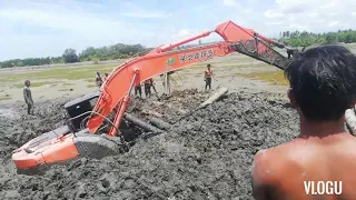 Hitachi backhoe stuck in mud