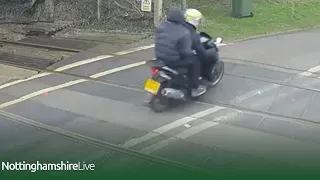 Shocking near miss between train and red-light-running moped