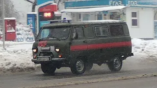 Utility UAZ(former ambulance) responding with blue lights during snowfall
