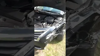 Wrecked Nissan Altima.