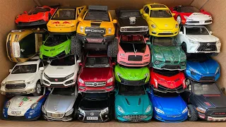 BOX full of model Cars, Ford, Dodge Charger, Beetle, Tesla, Rolls Royce, Ferrari, McLaren.