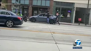 Fight between Tesla driver, motorcyclist erupts in middle of Pasadena street