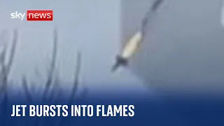 A Russian fighter jet is filmed in flames just before crashing during a training flight