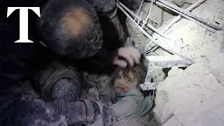 Young child pulled alive from earthquake rubble by White Helmets in Syria
