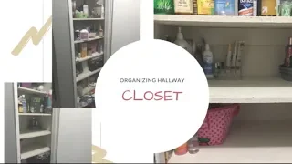 Decluttering and organizing hallway closet