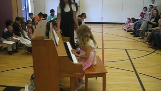 Palina Voitka plays piano