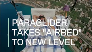 Paraglider takes "airbed" to a whole new level