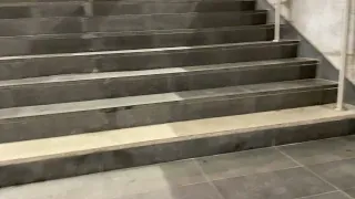 Malmö Station, walking up the stairs in Malmö, Sweden