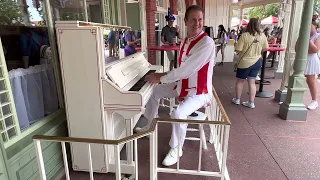 Neal playing Piano at Disneys Casey’s Corner in Magic Kingdom