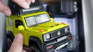 Металлическая машинка Suzuki Jimny открывается всё, горят фары, длина 21 см. масштаб 1:18