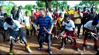 white man dancing kinachung with the locals