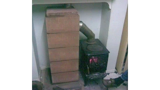 Masonry wood stove heat exchanger
