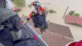 Italian residents rescued from flood via dinghys and helicopters