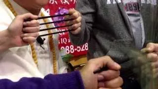 Grand Master Qi Feilong  Kung Fu Master Chi Demonstration Cuts 4 chopsticks with $20 bill.