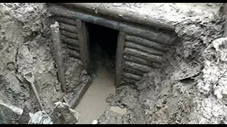 EXCAVATION OF A GERMAN DUGOUT WITH WEAPONS AND AMMUNITION