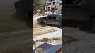 No songs or music overlays, just a 2WD Tacoma hustling up a slick, snowy hill.