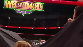 Stephanie McMahon puts Ronda rousey through a table