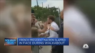 Two people detained after French President Emmanuel Macron slapped in the face during walkabout