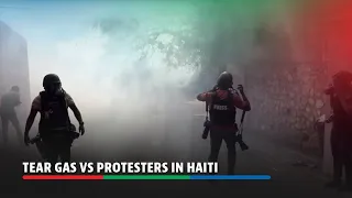 Haitian police deploy tear gas as angry protesters loot, burn barricades | ABS-CBN News