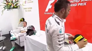 Nico Rosberg throws the 2nd position cap to Lewis Hamilton after losing 2015 World championship