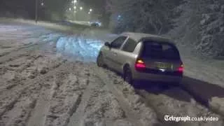 Wild weather blankets parts of UK in snow