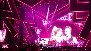 Robbie Williams with his wife Ayda Field on stage