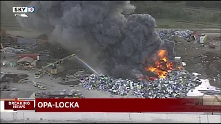 Firefighers use foam at metal recycling plant in Opa-locka