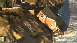 Aerial view: homes fall into sea in Hemsby, Norfolk after tidal surge