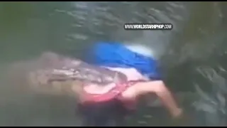 Crocodile Spotted With A Woman In His Mouth Swimming Through A Lake! (Its A Fearful Thing)
