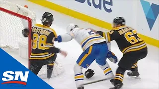 David Pastrnak & Brad Marchand Team Up On Rasmus Dahlin For Ruthless Cross Check