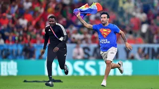 Pitch invader runs onto grass with rainbow flag during Portugal vs Uruguay!