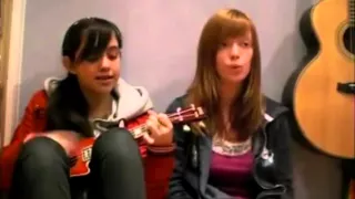 The two girls are very nice with a guitar singing a love song