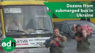 Firefighters save dozens from submerged bus in Ukraine