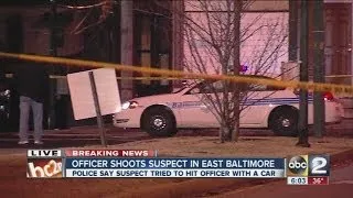 Baltimore police officer shoots at armed robbery suspect after he attempts to hit officer with a car