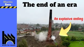 An explosive demolition of a mill chimney