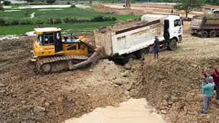 Smart Recovery Stuck Dump Truck Using Big Shantui Bulldozer Clearing Soil And Filling The Lake