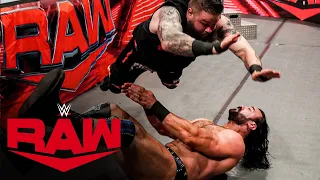 Kevin Owens flattens Drew McIntyre with a devastating splash on the ringside floor