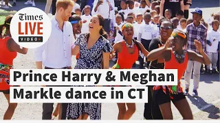 Prince Harry and Meghan Markle dancing in Cape Town