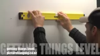 The best way to hang your picture frames straight and in a row