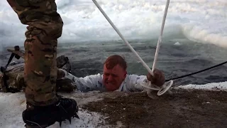 British Royal Marines Commandos train US Marines to survive in freezing water.