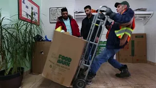 Muslim youth group helps out in a big way with food bank donation