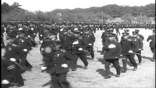 Japanese policemen march along the Imperial Palace grounds in Tokyo, Japan. HD Stock Footage