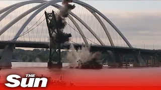 Huge suspension bridge crashes down in controlled explosion in Iowa