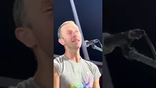 Chris Martin beautifully covers Elton John’s "Your Song" in the rain in Zurich.