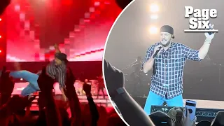 Luke Bryan falls on stage after slipping on fan’s cellphone: ‘My lawyer will be calling’