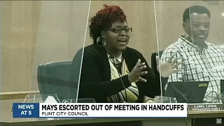 Flint councilman escorted from meeting in handcuffs