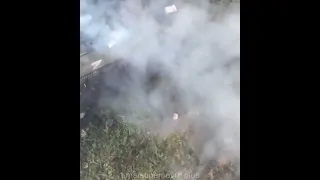 A Russian MT-LB running over TM-62 anti-tank mines on a road.