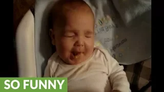 Baby eats peas for the very first time