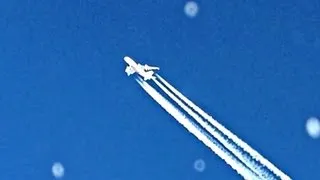 Airbus A380 airplane fly by with contrails